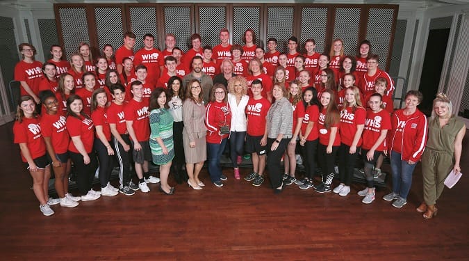 Students from Wadsworth High School, Ohio choir group, pose with five-time CMA Vocal Group of the Year Little Big Town and Mickey Mouse as they kick off Music In Our School Tour at Disney. (L-R)  Jane Mell Balek, Give a Note CEO, Karen Fairchild, Jimi Westbrook, Terry Dola, Disney Performing Arts vice president, Kalyn Davis school choir director, Philip Sweet, Kimberly Schlapman, Sarah Trahern, CMA CEO, and Radio Disney Country correspondent Savannah Keyes (far right).