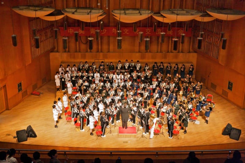 The combined bands of the North Monterey County High School Symphonic Band and the People’s Liberation Army Band of China, playing our national march Stars and Stripes Forever, followed by the playing of the Chinese national march Motherland, at the China National Performing Arts Center in Shijiazhuang, China. The conductor is D.L. Johnson.