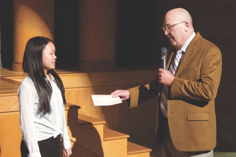 Claire Cao, 7th Grade Student at Tohickon Middle School, Doylestown, PA receives scholarship award from Jim Forester, Russo Music, Chalfont.Pa.  