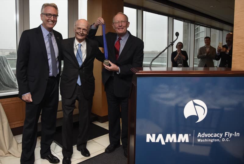 Richard Wilson Riley and NAMM President Joe Lamond presents the SupportMusic Champion Award to Senator Lamar Alexander (R-TENN) during a reception at Nelson Mullins on May 23, 2016 in Washington DC. (Photo by Kris Connor/Getty Images for NAMM)